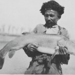 A Lopliq with one of the huge Lop-nor fishes A Lopliq with one of the huge Lop-nor fishes